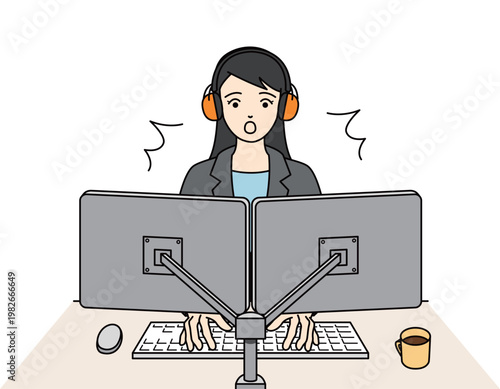 聴覚保護のイヤーマフを装着しPC作業中に驚くスーツの女性