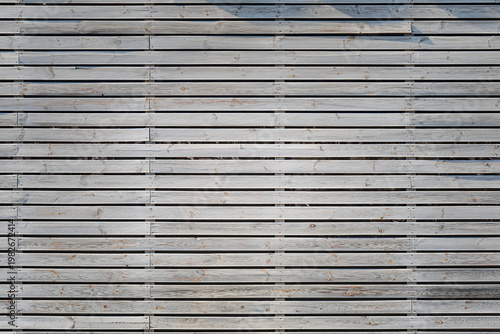 weathered grey wooden plank wall with horizontal parallel lines