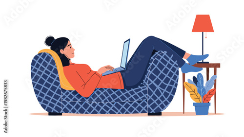 Young woman relaxes on a comfortable plaid sofa while working on her silver laptop in a cozy home environment with a lamp.