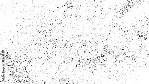 Gray dots scattered on white textured surface with black specks abstract background