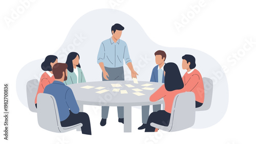 Team brainstorming session around a table with sticky notes and cards