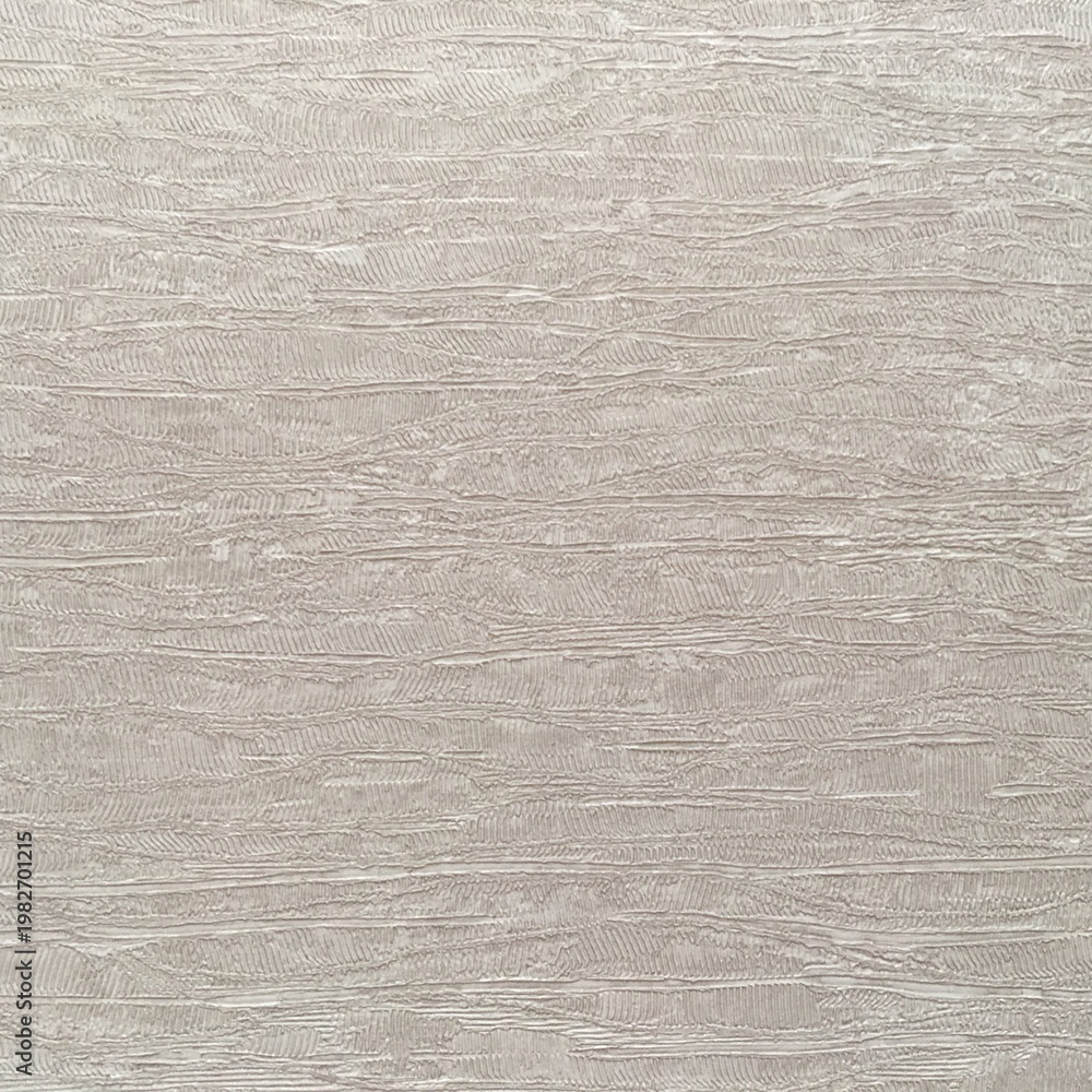 Fototapeta premium Textured surface showing light gray tones with subtle patterns at a close range during daylight