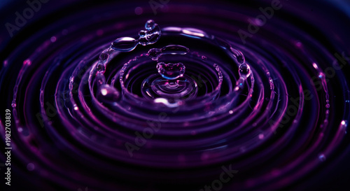 Vibrant water ripple creates mesmerizing concentric patterns on dark liquid surface. single drop generates dynamic motion, evoking tranquil calm