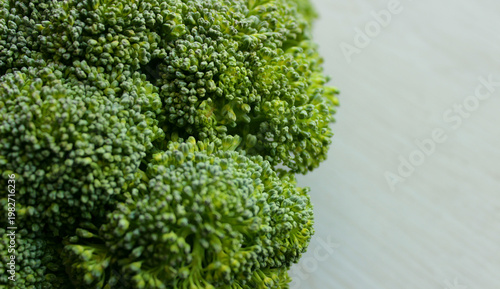 Close up of green broccoli Inflorescences on a cutting board copy space image
