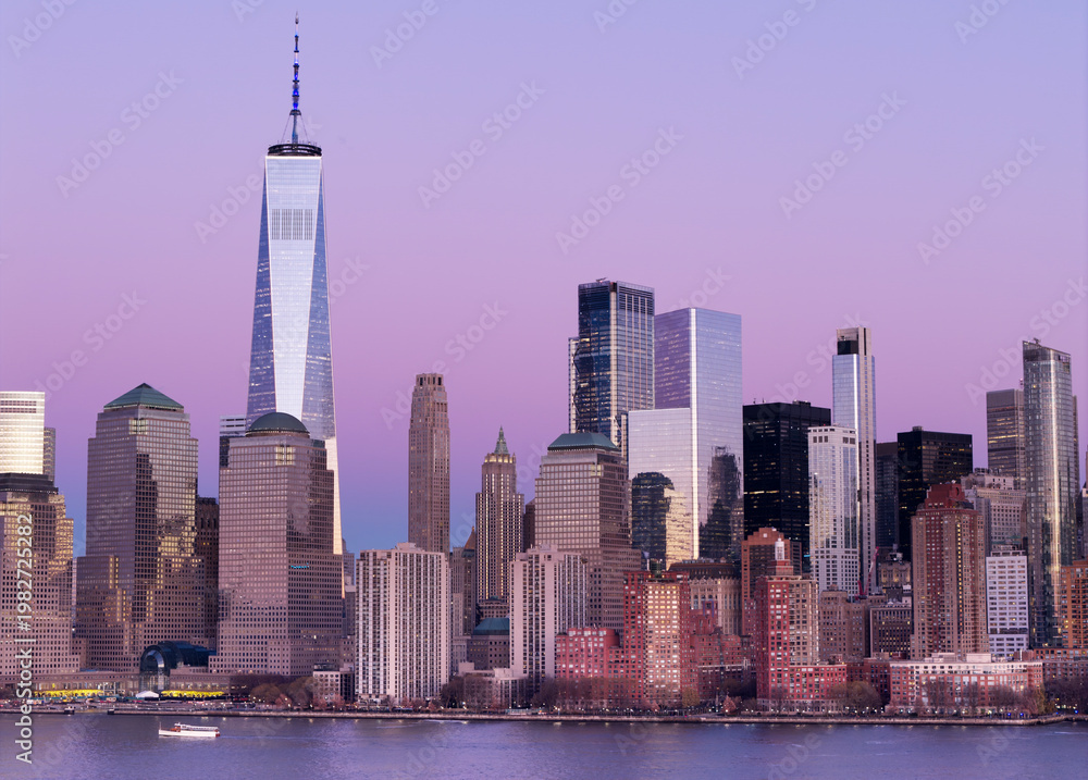 Fototapeta premium New York City panorama at sunrise. Manhattan skyline at dusk. New York City skyscrapers panorama at sunset. Manhattan panoramic skyline at dusk. New York City skyline background at sunrise.