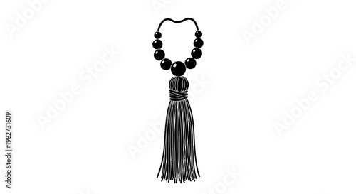 A black necklace with a decorative tassel isolated on a white background