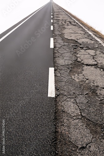 Road Split Between Smooth and Damaged Conditions