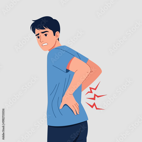 Man with Lower Back Pain, Holding His Back in Discomfort