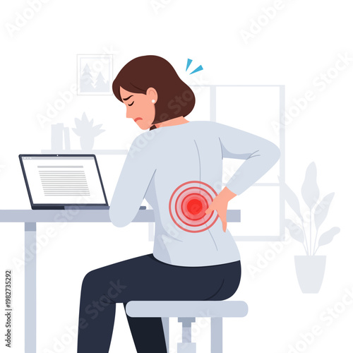 Woman suffering from back pain while working on a laptop at a desk, office setting.