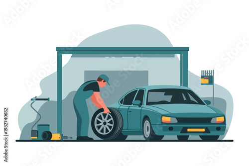 Mechanic repairs a car tire inside a professional service garage.