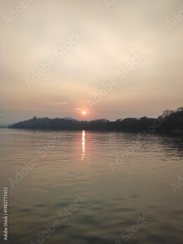 Traditional River Boat with Lao Flag and Mountain Landscape