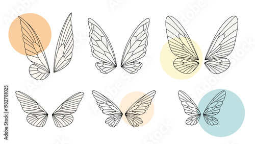 Collection of six pairs of delicate butterfly or fairy wings in different styles and shapes, decorated with colorful circular accents.