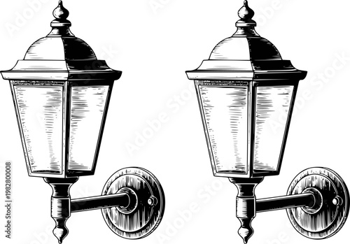 Vintage black and white wall lanterns with glass panes and ornate details, isolated white