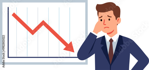 Businessman looks concerned at declining graph on screen with red arrow
