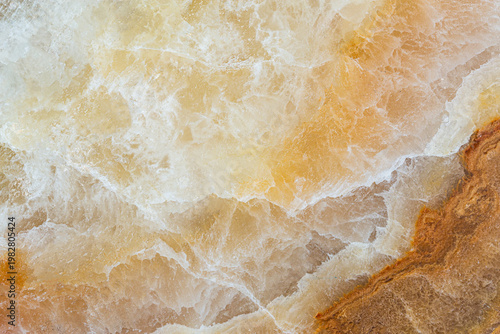 Abstract marble texture with white and orange mineral patterns