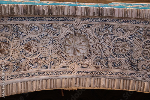 Close-up of the underside of an arch ornamented in Moorish architectural style in the Alcázar Real of Seville, Andalusia, Spain