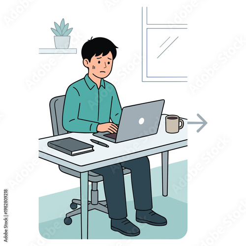 A man sits at a desk working on a laptop in an office