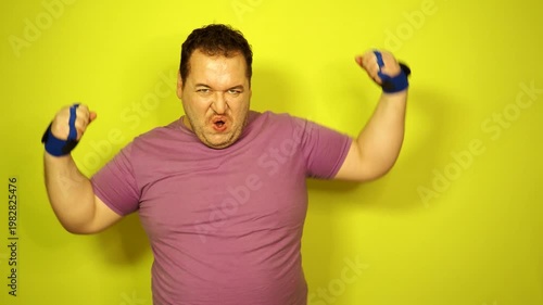 Retro style and fitness club. A funny fat man from the 80s goes in for sports.