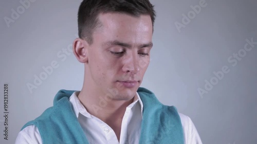 Phone call by cellphone. Attractive charismatic stylish guy has an unpleasant phone