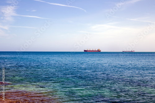 Rendezvous of two ships on the high seas. Oil tanker ship on the high seas. Tanker ship on the horizon