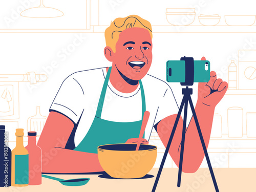 A smiling man in a kitchen recording a video for a cooking blog on his phone