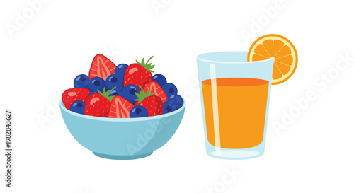 A light blue bowl overflowing with fresh strawberries and blueberries sits next to a glass of vibrant orange juice with a decorative orange slice garnish.
