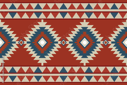 Southwestern seamless pattern with geometric diamond motifs. Traditional tribal vector design in terracotta red, blue, and cream. Ideal for ethnic textiles, rugs, and cultural backgrounds.