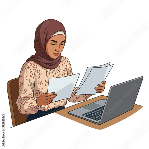 A woman wearing a hijab studies documents at a desk with a laptop.