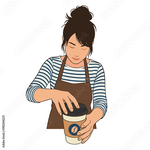 A woman in an apron is carefully handling a coffee cup indoors.