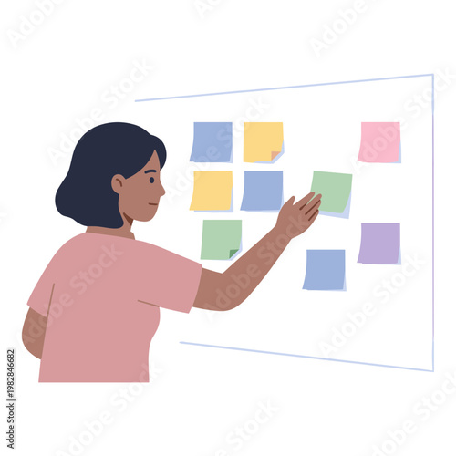 Woman places colorful sticky notes on a large whiteboard in an office
