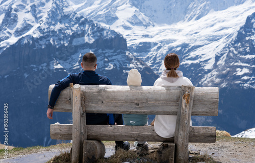 Family at the Grindelwald Valley and mountain trail in Switzerland. Swiss alps