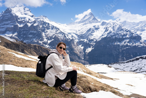 Woman hiking in the Swiss Alps mountains during vacation, Grindelwald, First Cliff Walk