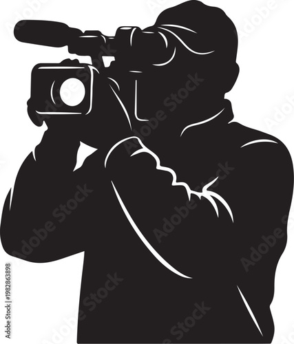 Silhouette of a videographer recording with a camera
