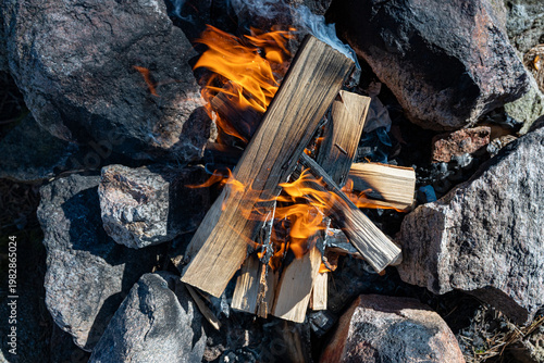 Open fire inside ring of stones for safety