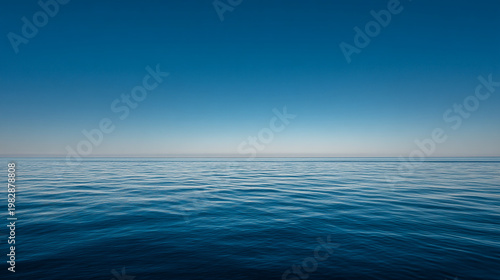 Expansive blue sky over the gentle waves of the ocean with clear sky no people water surface