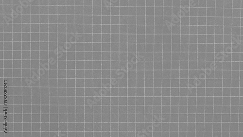 Technical grid pattern with intense white noise and grainy texture on grey background for retro screen effect and analog signal interference overlay