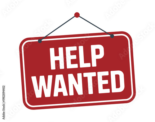 A red help wanted sign hanging on a white background with a black string