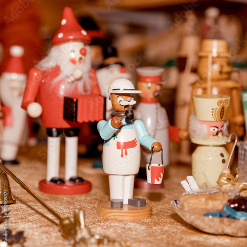 Colorful wooden christmas figures on display at festive market