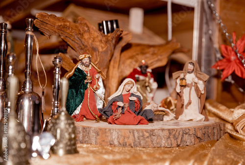 Nativity scene with figurines and decorations on wooden base