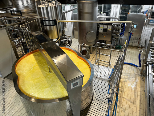 selective focus industrial dairy vat for cheese production with agitator