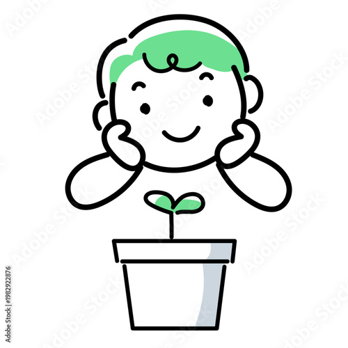 植物の芽を見つめる男の子