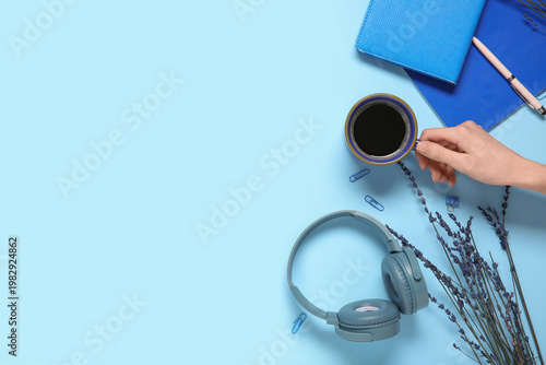 Female hand with cup of cof...