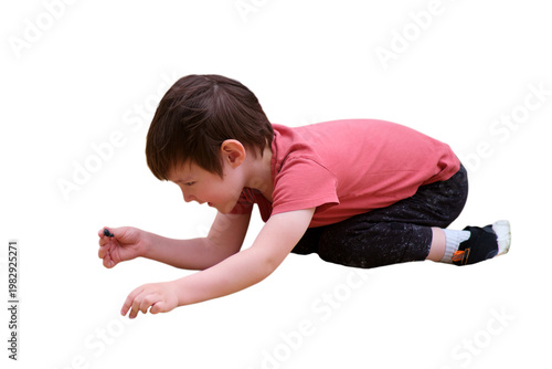 Foto Young boy crawling on floor and playing with toy
