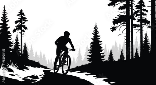 A silhouetted mountain biker rides a trail through a forest landscape