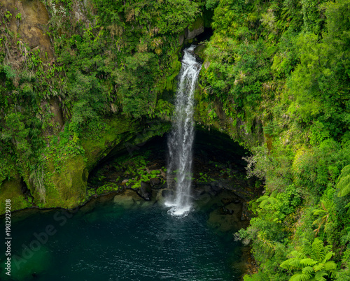 Omanawa falls flowing into natural turquoise pool