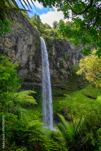 Bridal veil falls flowing over a rugged cliff, New Zealand