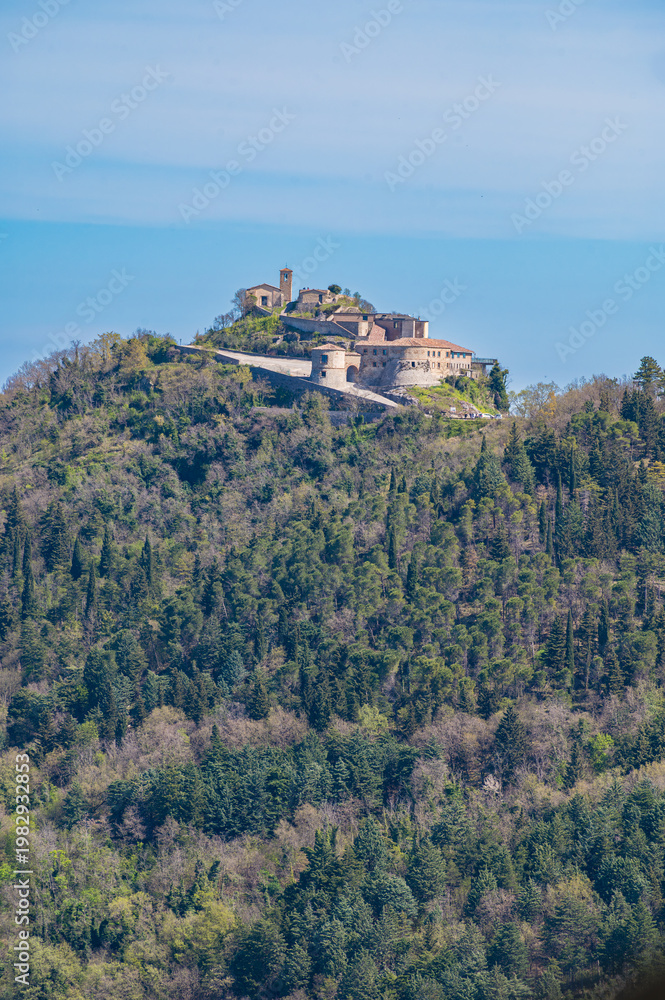 Fototapeta premium Medieval castle ruins on rocky hilltop, Torriana Scorticata Valmarecchia landscape, Rimini Emilia Romagna Italy, historic fortress architecture, scenic countryside view