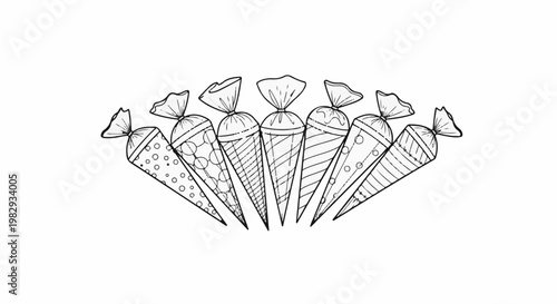 A row of seven decorated candy cones, some with dots, lines, and swirls