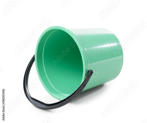 Overturned green plastic bu...
