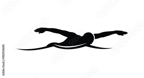 A swimmer in motion powerfully gliding through water depicted as a silhouette